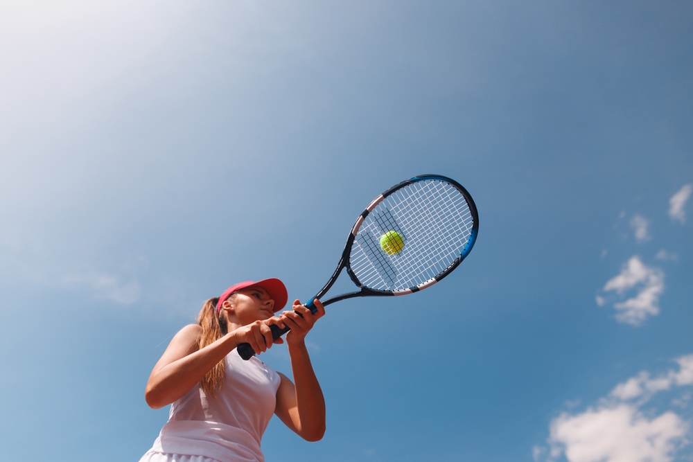 Young,female,tennis,player,preparing,to,hit,a,ball,with